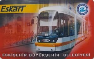 Close-up of the official red and yellow Eskart, the reusable plastic card used for all bus and tram fares on the Eskişehir public transport network.