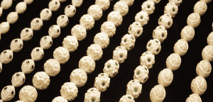 Assorted Lületaşı (meerschaum) from Eskişehir, featuring intricate designs with green and purple gemstone inlays, suitable for bracelets or necklaces.